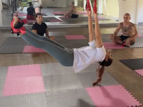 Gravity Stretching studio, a class in hanging straps